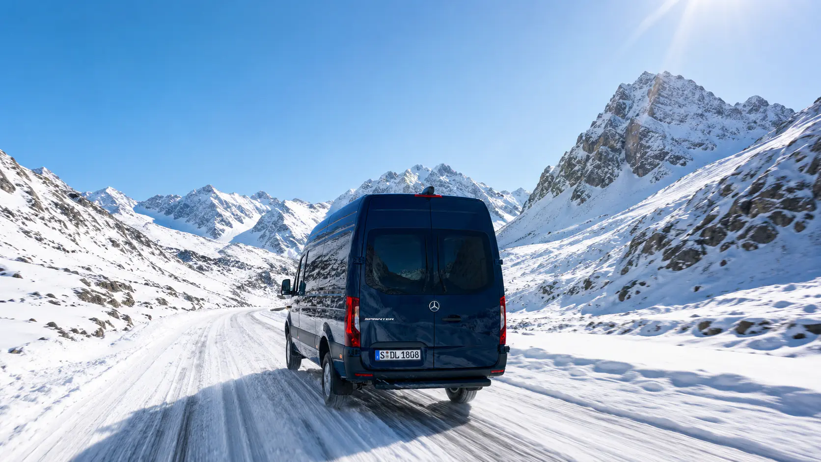 An INSIGNIA van traveling a mountain road